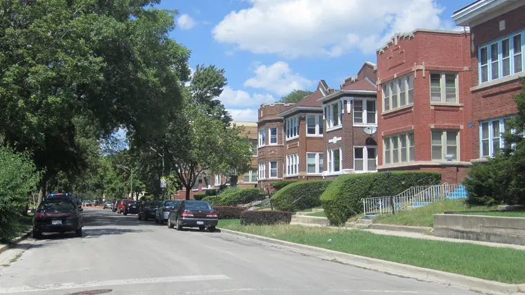 Brick two-flat buildings on a Chicago street, the same type of housing found across Cicero